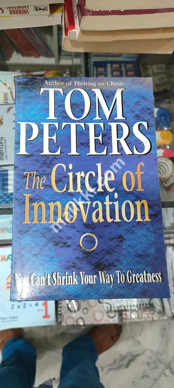 TOM PETERS